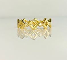 14K Gold and Diamond Geometric Eternity Band METAL: 14K Yellow Gold. Can also be custom made in Rose Gold, White Gold. DIAMONDS: 8 Round Brilliant Diamonds  COLOR: G/H CLARITY: VS1 DIAMETER: 1.5 mm TOTAL WEIGHT .08 SIZES: Ladies US Sizes 4-9. Please make sure your size is correct as these can not be resized. If you need a size over 9, please contact me and i'll make it happen for you. (Prices will vary) DESCRIPTION: This dainty and fun eternity band can be stacked with another one of itself (get Modern Gold Eternity Band With Diamond Accents, Modern Gold Diamond Eternity Band, Eternity Rings Stackable, Medieval Crown, Band Metal, Rose Gold White, Ring Dainty, Bezel Diamond, Eternity Band