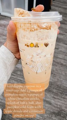 someone holding up a starbucks drink with the caption iced cappuo expresso in a vending cup