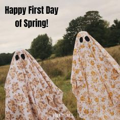 two ghost like figures with the words happy first day of spring