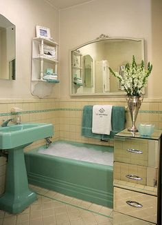 a bathroom with a sink, mirror and bathtub