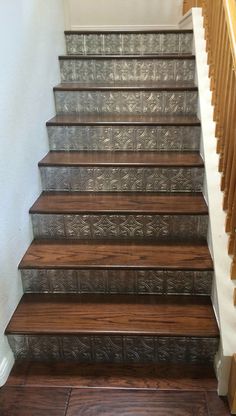 a set of stairs with wooden treads and handrails