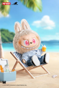 a stuffed animal is sitting in a chair on the beach with an ice cream sundae