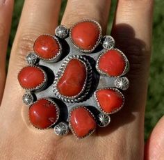 Navajo Native American Sterling Silver Red Coral Cluster Adjustable Ring. Width: 1.75 inch Artist: T Jon Best Offers Accepted! Adjustable Red Turquoise Ring As Gift, Southwestern Red Gemstone Jewelry, Southwestern Style Red Jewelry For Gifts, Southwestern Style Red Gemstone Jewelry, Southwestern Style Red Jewelry For Gift, Red Southwestern Style Jewelry Gift, Handmade Southwestern Red Jewelry, Red Southwestern Style Collectible Jewelry, Artisan Red Oval Jewelry