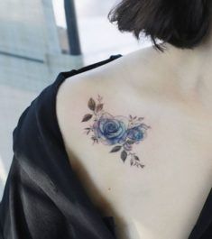 a woman with a tattoo on her shoulder