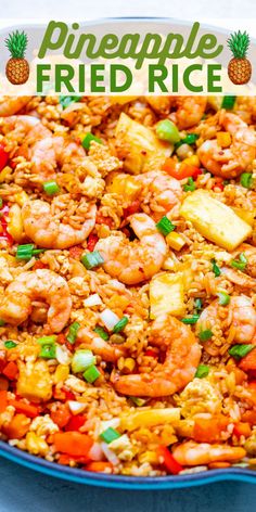 a dish with shrimp, pineapple and fried rice in it on a blue plate