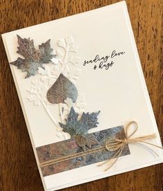 a card with some leaves on it