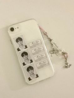 an iphone case with some pictures on it and a keychain attached to it