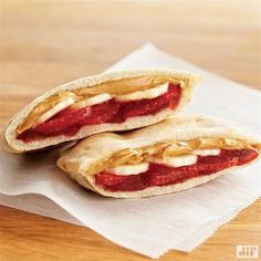 two pita breads sitting on top of a white napkin