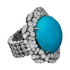 This gorgeous blue Turquoise ring will impress everyone around you. It features a 5.60 carat round shape gemstone, adorned with 2.87 carat natural diamonds. Ring : 18K white gold, .15.70 gr. Main stone: Round Cabochon Turquoise Number: 1 Carat: 5.60 carat Color: Blue Cut: Excellent Natural Diamonds Round natural diamonds Carat: 2.87 carat Color: D - F Clarity: VS Cut: Very good - Excellent Diamonds Ring, Art Deco Diamond, Blue Turquoise, 1 Carat, Cocktail Rings, Turquoise Blue, Round Shape, Turquoise Ring, Natural Diamonds