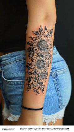 a woman with a sunflower tattoo on her arm