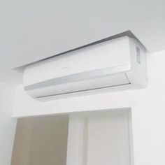 an air conditioner mounted to the side of a wall