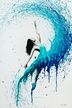 a woman is floating in the air with blue paint on her body and arms outstretched