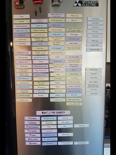 a stainless steel refrigerator covered in lots of magnets