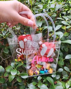 someone is holding a clear plastic bag with candy in it that says,'sequins & fuma '