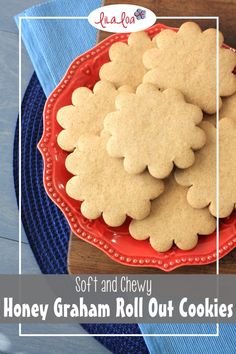 a red plate topped with cookies on top of a wooden table