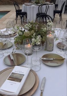 the table is set with plates and silverware