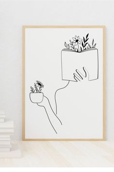 a black and white drawing of a hand holding a potted plant with flowers in it