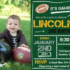 a little boy sitting in the grass with a football and helmet on his chest, next to a green chalkboard sign that says it's game lincoln 2nd birthday