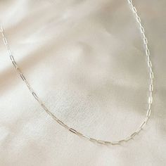 Sterling silver dainty paperclip chain necklace; adjustable. Length: 16” + 2” extender Sterling silver paperclip chain. Handmade in West Chester, Pennsylvania Cotton Jewelry, Paperclip Necklace, Paperclip Chain Necklace, Stacked Earrings, West Chester, Dainty Chain, Gold Filled Ring, Gift Pouch, Chain Choker