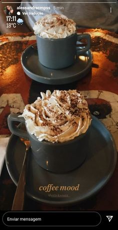 two cups of coffee with whipped cream on top