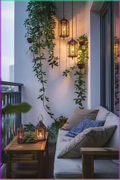 the balcony is decorated with hanging plants and lanterns, along with two tables that have candles on them