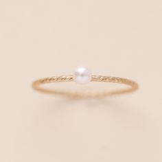 This is a great texture piece.  It makes any stack more versatile and beautiful, and features the cutest pink pearl. This dainty look will be great with the a stack or by itself. Details: Location: Finger (order larger or smaller sizes depending on which finger you choose to wear it) Thickness: 3mm Sizes: 5,6,7,8 Style: Minimalist/Dainty Made with: 14K Gold Filled Why Gold Filled? Gold filled is a layer of 14K gold that has been pressure bonded to a brass base metal. Gold filled has 100 times more gold than gold plating and is much more valuable and tarnish resistant. It will not flake, rub off, or turn color. It can be worn without worries of an allergic reaction to the jewelry. Rings Minimalist, Dainty Rings, Sparkling Rings, Twist Ring, Rings For Girls, Western Jewelry, Be Great, Minimalist Rings, Pink Pearl