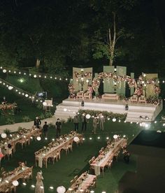 an outdoor wedding reception set up at night