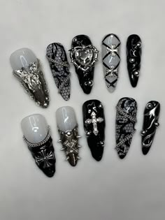 Goth punk princess nails Version 2.    These are  Hand painted soft gel press on nails. Each kit comes complete with 10 nails, buffer, file, alcohol wipe, wooden cuticle pusher, nail glue and sticky tabs.  Custom colors can be requested but are made to order and may have a longer processing time. *all press ons come pre-etched on the inside of the tip for better adhesion to your natural nails* variations may occur depending on length and/or shape. No two sets are completely alike. Nails can be r Goth Nails Press On, Girly Grunge Nails, Safety Pin Nails, Metal Head Nails, Black Nails Silver Design, Y2k Nails Cross, Rokku Gyaru Nails, Goth Acrylic Nail Designs, Gothic Nails Black