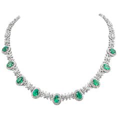 Beautiful emerald and diamond necklace.  19.10 carats total gemstone weight.  9 oval shaped emeralds, 6.53 carats, apx F2. 805 round and baguette cut diamonds, approximately G/H color and VS2/SI1 clarity. 18k white gold, 33.58 grams, 16.5 inches.  Accommodated with an up-to-date digital appraisal by a GIA G.G. once purchased, upon request. Please contact us with any questions. Gucci Necklace Gold, Flat Gold Necklace, Emerald Jewelry Necklace, Emerald Diamond Necklace, Emerald And Diamond Necklace, Black Gold Necklace, Silver Coin Necklace, Star Necklace Silver, Silver Choker Necklace