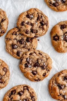 several chocolate chip cookies on wax paper