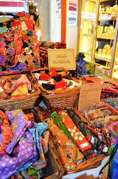 many baskets filled with different types of cloths