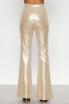 A Faux Leather Pant featuring bell bottom with front zip closure. Seamed Metallic Gold S (4-6) M (6-8) L (8-10) 91% Polyester 9% Spandex National Finals Rodeo, Gold Pants, New Orleans Mardi Gras, Metallic Pants, Leather Pant, Bold And The Beautiful, Unique Boutique, Faux Leather Pants, Bell Bottom