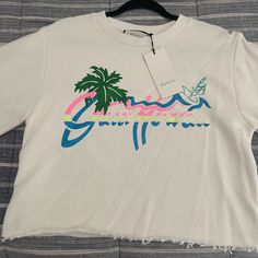 Authentic Gucci Crop Top Tee Never Been Worn With Tags In A Size Xs Still On Gucci Website Designer Gucci Tops For Spring, Casual Gucci Tops For Summer, Gucci Graphic Print Top For Spring, Gucci Cotton Tops For Spring, Gucci Crew Neck Spring Tops, Gucci Casual White Top, Trendy White Gucci Tops, Casual White Gucci Top, Gucci White Crew Neck Top