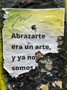 a piece of paper that has been torn in half with graffiti on it and the words abrazte era un arte, y ya no sonos