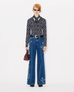 'KENZO Marguerite' all-over shirt.
Fluid Printed Viscose.
KENZO archive signature included in the pattern. Luxury Printed Blouse For Spring, Designer Fitted Printed Blouse, Lucky Tiger, Polo Sweatshirt, Cardigan Shirt, Dark Blue Color, Sweatshirt Dress, Skirt Pants, Sweater Hoodie