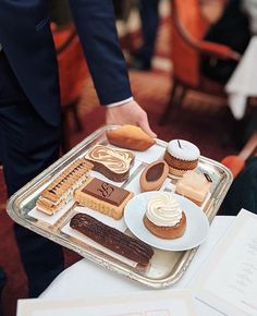 a tray filled with different types of desserts