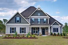 a large gray house with lots of windows