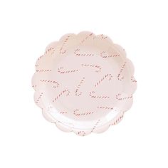 a pink paper plate with red and white writing on it