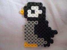 a black and white penguin made out of legos