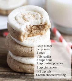 a stack of cookies sitting on top of each other next to a glass of milk