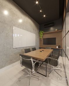 an empty conference room with a wooden table and black leather chairs in front of a white board