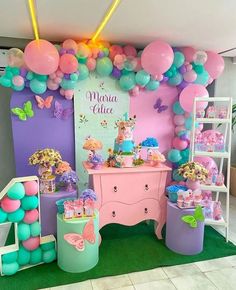 a room filled with lots of balloons and decorations