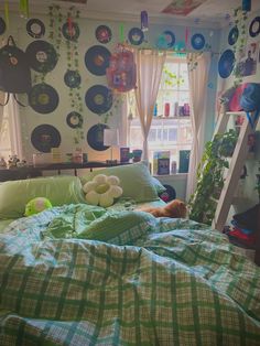 a dog laying on top of a bed in a bedroom next to a ladder and window