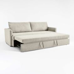 a white couch with two pull out drawers on it's back and the bottom section is open