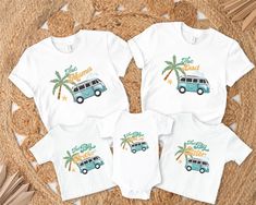 the family matching tees are on display in front of a rug with palm trees