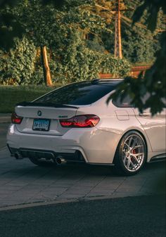 a white sports car parked on the street