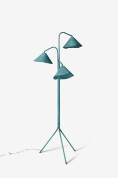 a blue floor lamp with three lamps on it