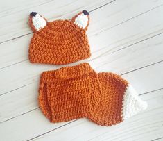 two crocheted hats and diaper covers made to look like an orange fox