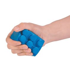 a child's hand holding a blue plastic object in it's left arm