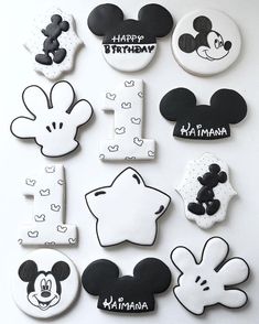 mickey mouse birthday cookies are arranged on a table